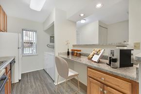 Lancaster apartment for rent - A kitchen with a white chair and a white fridge.
