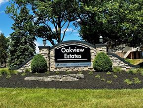 Lancaster apartment for rent - A sign for Oakview Estates is displayed in front of a building.