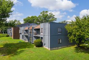 Lindenwold apartment for rent - A grey building with a green lawn in front.