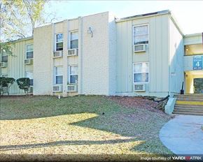 Tallahassee apartment for rent - an apartment building with a yard in front of it