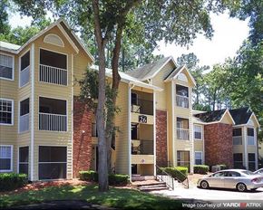 Gainesville apartment for rent - an apartment building with a car parked in front of it