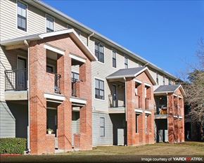 Tallahassee apartment for rent - a brick apartment building with two balconies