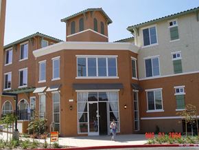 San Jose apartment for rent - A building with a brown facade and a green roof.