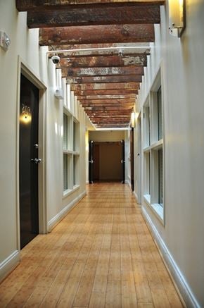 Richmond apartment for rent - a hallway with a wooden ceiling in a building