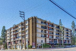 Lake Balboa apartment for rent - a large apartment building on the corner of a street