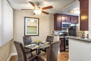 Los Angeles apartment for rent - a kitchen and dining room with a table and chairs