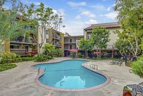 Los Angeles apartment for rent - a resort style swimming pool in front of an apartment building