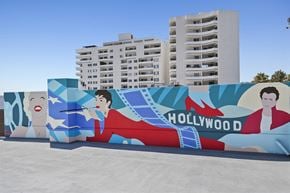 Hollywood apartment for rent - a large hollywood mural on the side of a building