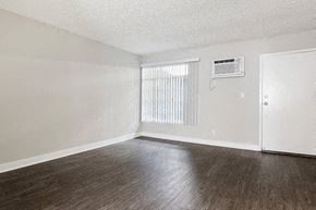 Los Angeles apartment for rent - an empty living room with wood floors and a window