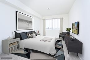 Los Angeles apartment for rent - an image of a bedroom with a bed and a desk