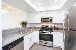 Los Angeles apartment for rent - a kitchen with stainless steel appliances and white cabinets