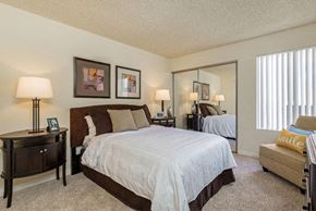 Los Feliz apartment for rent - a bedroom with a large bed and a mirror