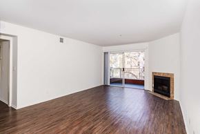 Los Angeles apartment for rent - a living room with a fireplace and wooden floors