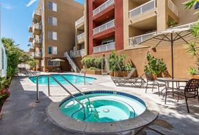 Los Angeles apartment for rent - a jacuzzi pool and patio with an apartment building in the background