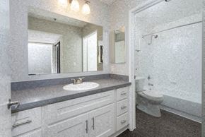 Los Angeles apartment for rent - A bathroom with a sink, mirror, and toilet.