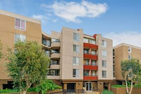 Los Angeles apartment for rent - A modern apartment building with a red accent on the balconies.