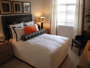 Los Angeles apartment for rent - a bedroom with a bed and a lamp and a window