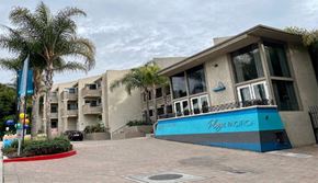 Playa Del Rey apartment for rent - a building with a blue sign in front of it