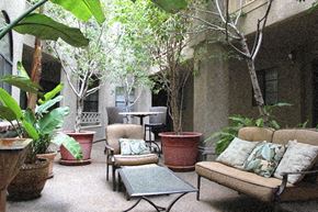 Los Angeles apartment for rent - a patio with couches and chairs and potted plants