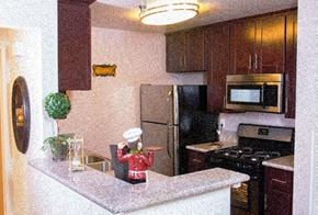 Los Angeles apartment for rent - a kitchen with a counter and a refrigerator
