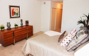 Los Angeles apartment for rent - a bedroom with a bed with pillows and a dresser