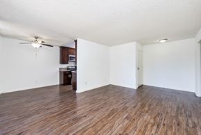 West Hollywood apartment for rent - an empty living room with wood flooring and a ceiling fan