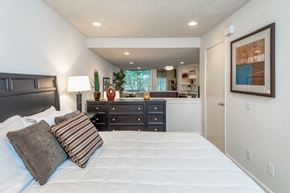 West Hollywood apartment for rent - a bedroom with a bed and a dresser and a bathroom
