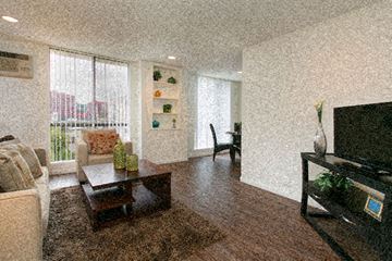 West Hollywood apartment for rent - a living room with a couch and a television