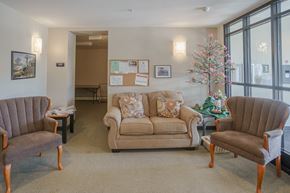 Littleton apartment for rent - a living room with couches chairs and a christmas tree