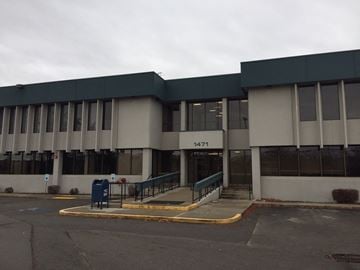 Boise apartment for rent - the front of a building with stairs and a blue mail box