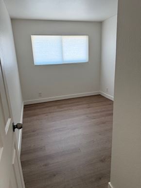 Vallejo house for rent - A room with a white door and a window with blinds.
