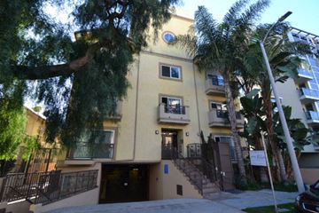 Los Angeles apartment for rent - the front of a building with stairs and a tree