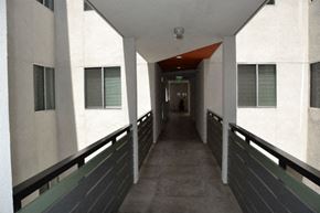 Los Angeles apartment for rent - A long hallway with a person standing at the end.
