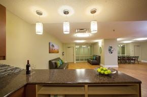 North York apartment for rent - A kitchen with a brown counter top and a bowl of green apples on it.