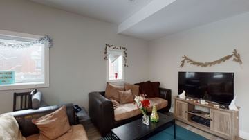 Ottawa apartment for rent - a living room with a couch and a tv