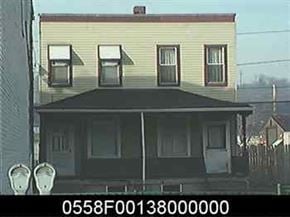 Glassport house for rent - a picture of a yellow house with a black roof