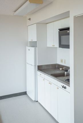 Wahiawa apartment for rent - Kitchen with white cabinets and appliances