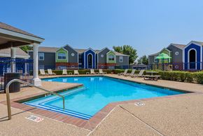 Denton apartment for rent - Pool surrounded by lounge chairs