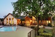 Austin apartment for rent - pool and exterior clubhouse at sunset