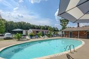 Meridian apartment for rent - Pool with lounge chairs at Landmark Apartment Homes, Mississippi