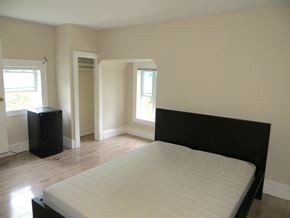 Ottawa apartment for rent - an empty bedroom with a bed and a window