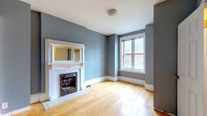 Ottawa apartment for rent - a living room with blue walls and a white fireplace