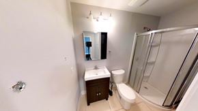 Ottawa apartment for rent - a bathroom with a sink toilet and a shower