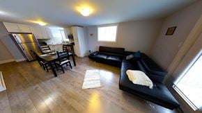 Ottawa apartment for rent - an overview of a living room with a couch and a table