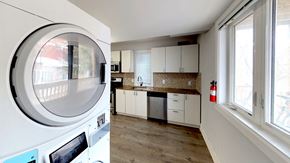 Ottawa apartment for rent - a kitchen with a washing machine and a window