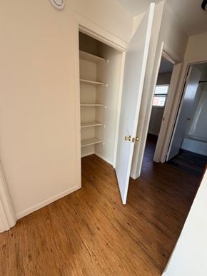 Hilliard apartment for rent - A room with a white door and shelves.