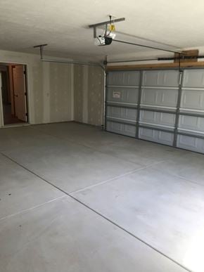 Lincoln house for rent - the inside of a garage with several garage doors