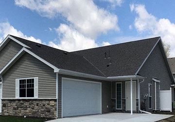 Lincoln house for rent - a gray house with a white garage door