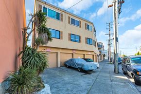 San Francisco apartment for rent - an apartment building with a car parked in front of it