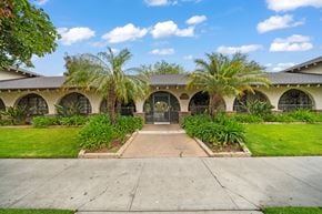 Anaheim apartment for rent - the front of a house with palm trees in front of it